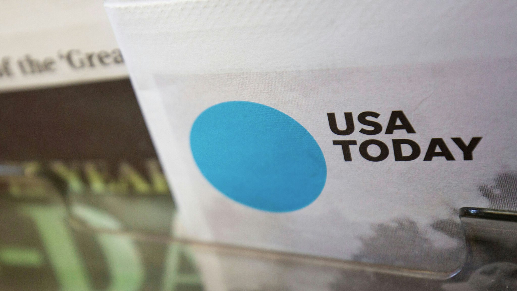 The front page of a special edition USA Today newspaper is seen at a convenience store in Washington, DC, on August 6, 2019.