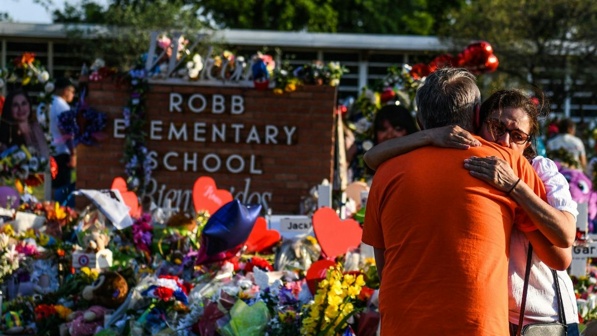 A woman cries at a makeshift memorial at Robb Elementary School in Uvalde, Texas, on May 30, 2022