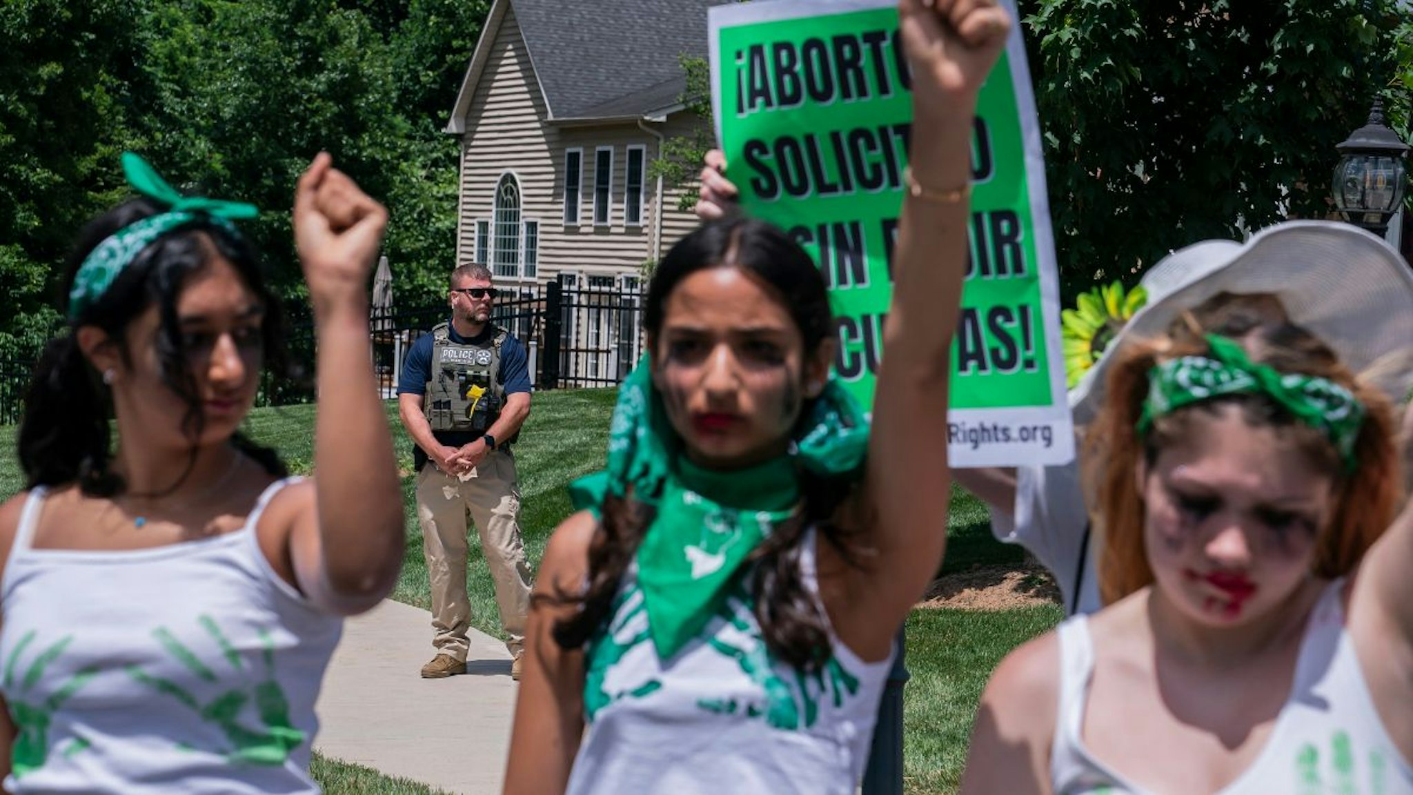 U.S. Marshalls guard the the home of Supreme Court Justice Amy Coney Barrett as abortion-rights activists rally nearby on June 18, 2022 in Falls Church, Virginia.