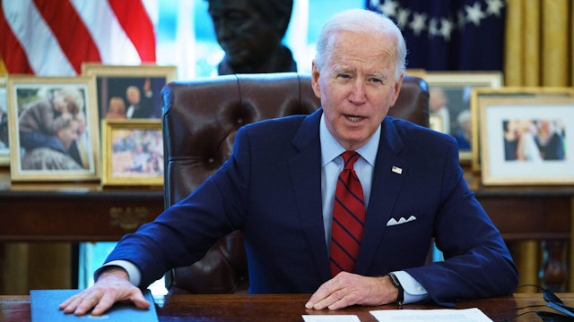 US President Joe Biden speaks before signing executive orders on health care, in the Oval Office of the White House in Washington, DC, on January 28, 2021.