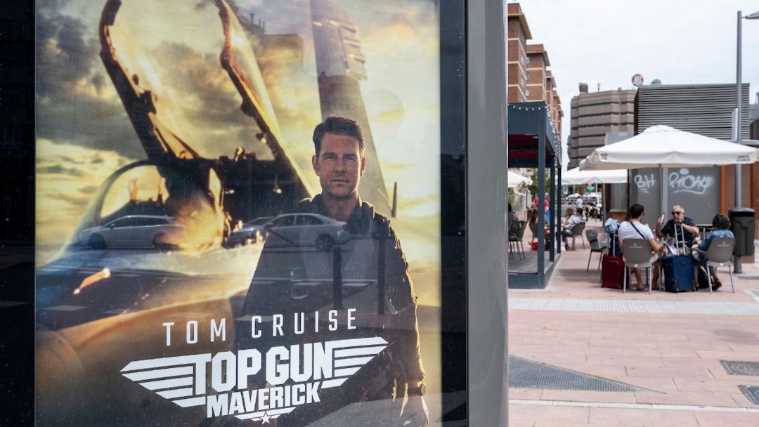 A street commercial advertisement poster from Paramount Pictures featuring Top Gun Maverick movie and American actor Tom Cruise in Spain.