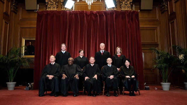 Seated from left: Associate Justice Samuel Alito, Associate Justice Clarence Thomas, Chief Justice John Roberts, Associate Justice Stephen Breyer and Associate Justice Sonia Sotomayor, standing from left: Associate Justice Brett Kavanaugh, Associate Justice Elena Kagan, Associate Justice Neil Gorsuch and Associate Justice Amy Coney Barrett pose during a group photo of the Justices at the Supreme Court in Washington, DC on April 23, 2021. (