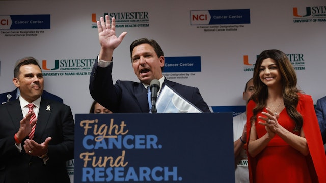 MIAMI, FLORIDA - MAY 17: Florida Gov. Ron DeSantis speaks during speaks during a press conference at the University of Miami Health System Don Soffer Clinical Research Center on May 17, 2022 in Miami, Florida. His wife first lady Casey DeSantis, who recently survived breast cancer, stands next to him. The governor held the press conference to announce that the state of Florida would be supplying $100 million for Florida's cancer research centers, after he signs the state budget into law.