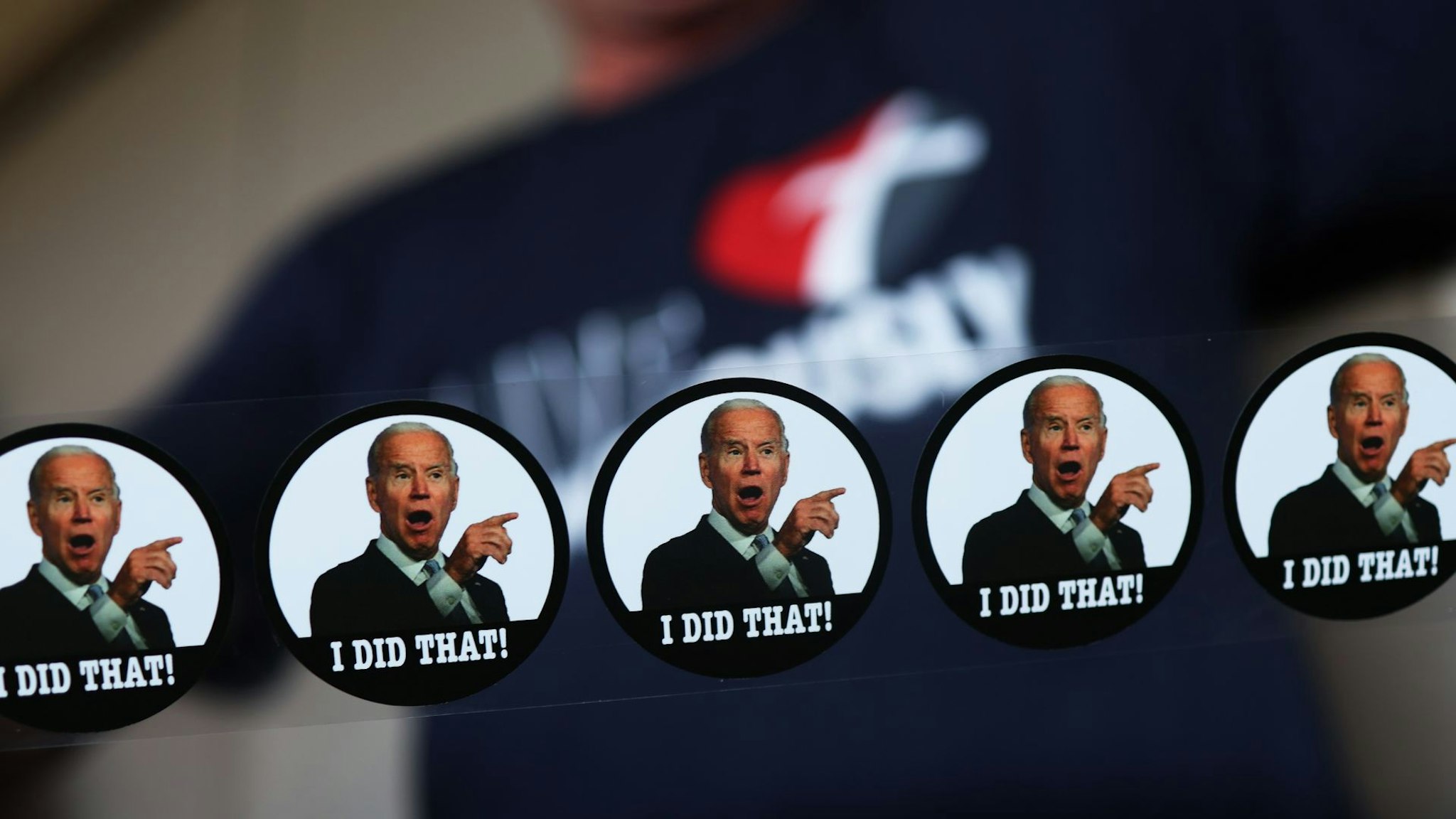 HARLEYSVILLE, PENNSYLVANIA - MAY 12: An attendee holds up stickers mocking President Joe Biden at a campaign event for Republican U.S. Senate candidate Dave McCormick at Leddy’s Pub on May 12, 2022 in Harleysville, Pennsylvania.