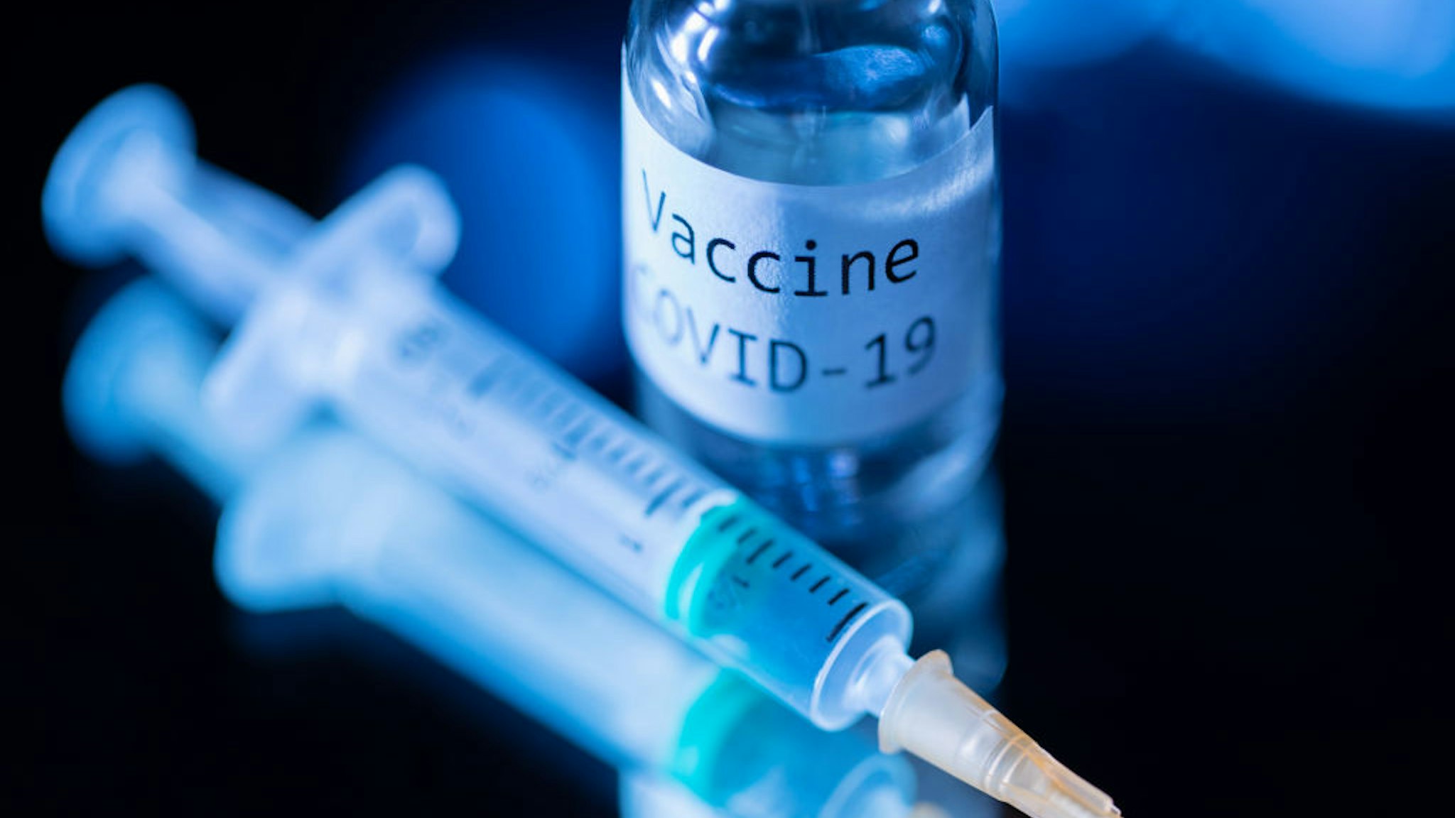 TOPSHOT - This picture taken on November 17, 2020 shows a syringe and a bottle reading "Vaccine Covid-19". - According to the World Health Organization, some 42 "candidate vaccines" against the novel coronavirus Covid-19 are undergoing clinical trials on November 17, 2020.