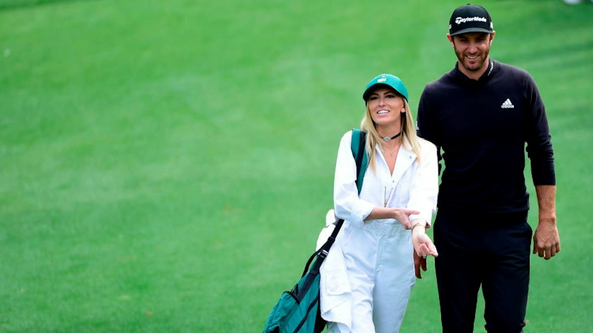 Dustin Johnson and his wife Paulina Gretzky walk up No. 1 during the Par 3 Contest at the 2016 Masters Tournament on Wednesday, April 6, 2016. (Photo by