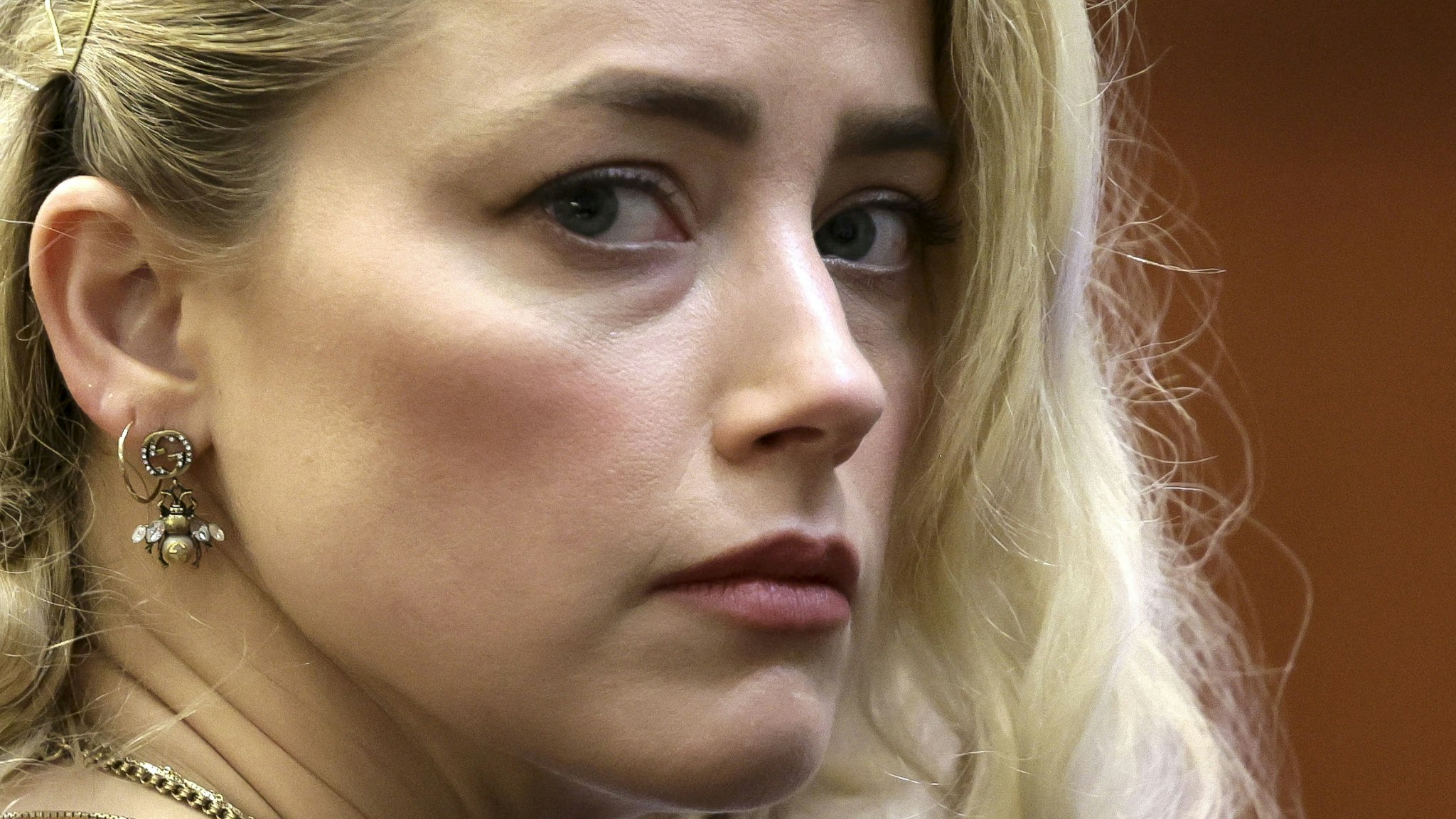 TOPSHOT - US actress Amber Heard waits before the jury announced a split verdict in favor of both Johnny Depp and Amber Heard on their claim and counter-claim in the Depp v. Heard civil defamation trial at the Fairfax County Circuit Courthouse in Fairfax, Virginia, on June 1, 2022. - A US jury on Wednesday found Johnny Depp and Amber Heard defamed each other, but sided far more strongly with the "Pirates of the Caribbean" star following an intense libel trial involving bitterly contested allegations of sexual violence and domestic abuse.
