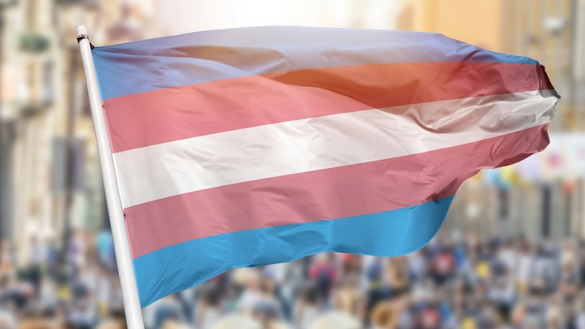 transgender flag blowing - stock photo Shot of the transgender flag blowing in the wind at street Cunaplus_M.Faba via Getty Images