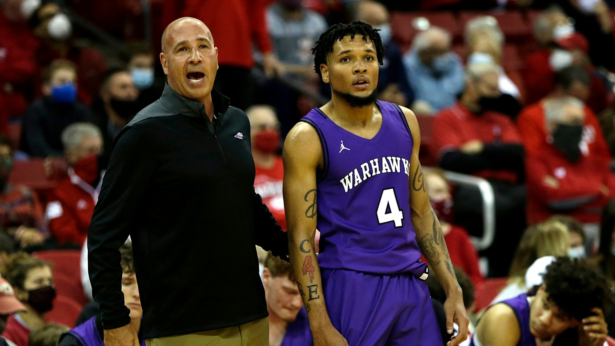 MADISON, WISCONSIN - OCTOBER 29: UW-Whitewater head coach Pat Miller and Derek Gray #4 look on in the first half against the Wisconsin Badgers during the exhibition game at Kohl Center on October 29, 2021 in Madison, Wisconsin.