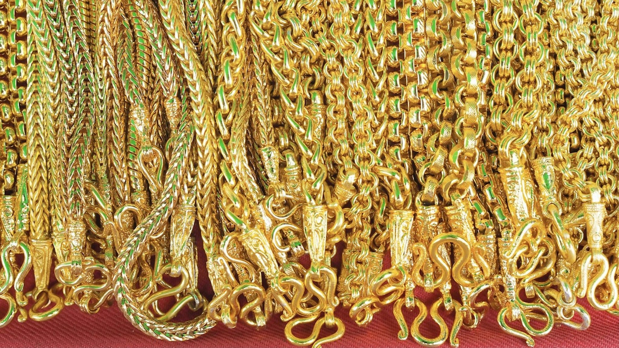 Close-Up Of Gold Chain Necklaces For Sale In Store - stock photo Apimook Pornsurin / EyeEm via Getty Images