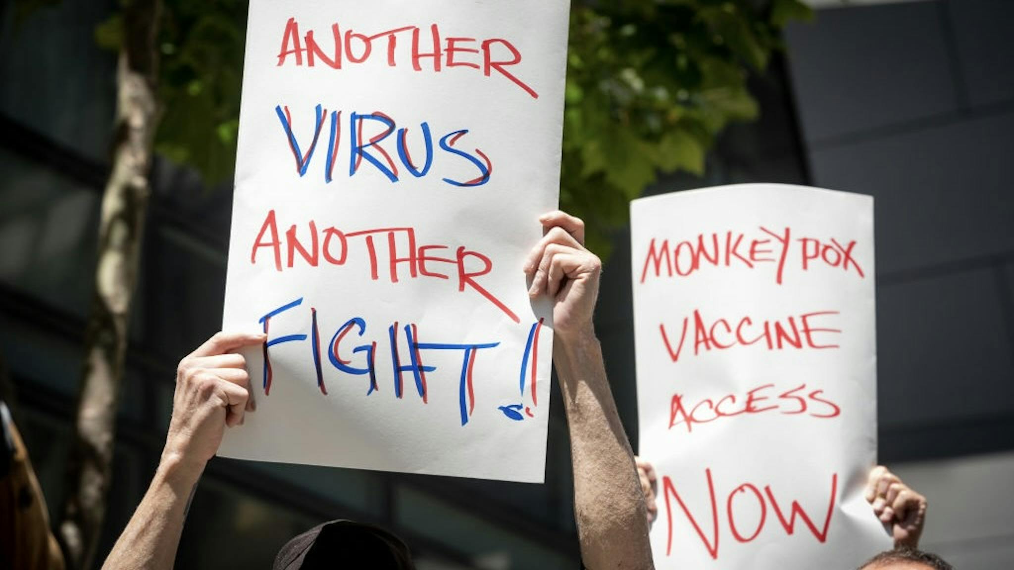 F64744AB-1099-4172-A9CE-10170DE8951A_1_201_a MONKEYPOX SAN FRANCISCO, CA - JULY 18: People hold signs during a rally to demand that the federal government respond quickly to the recent San Francisco monkeypox outbreak at the San Francisco Federal Building on July 18, 2022 in San Francisco, California. The rally, held to call for the Centers for Disease Control & Prevention and the U.S. Department of Health & Human Services to increase access to vaccines, ensure equity in vaccine and testing distribution and fight stigma against the LGBTQ+ community, was co-hosted by groups including the Alice B. Toklas LGBTQ Democratic Club, Harvey Milk LGBTQ Democratic Club and San Francisco AIDS Foundation. (Photo by Marlena Sloss for The Washington Post via Getty Images) The Washington Post / Contributor