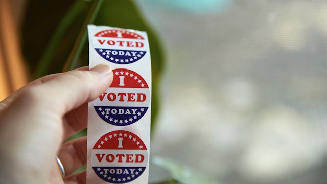 A person taking an "I Voted Today" sticker after casting their ballot. - stock photo EyeWolf via Getty Images