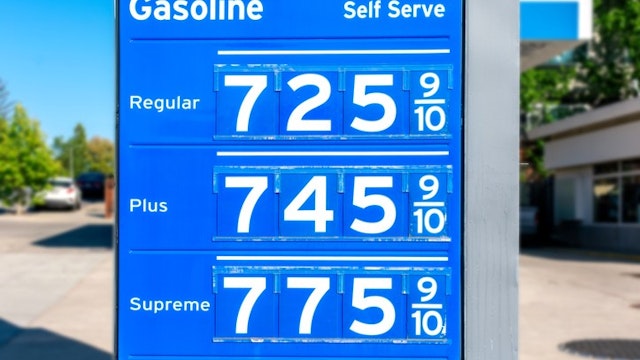 Gas station price sign showing record high gasoline prices for over seven dollars a gallon of regular gas.