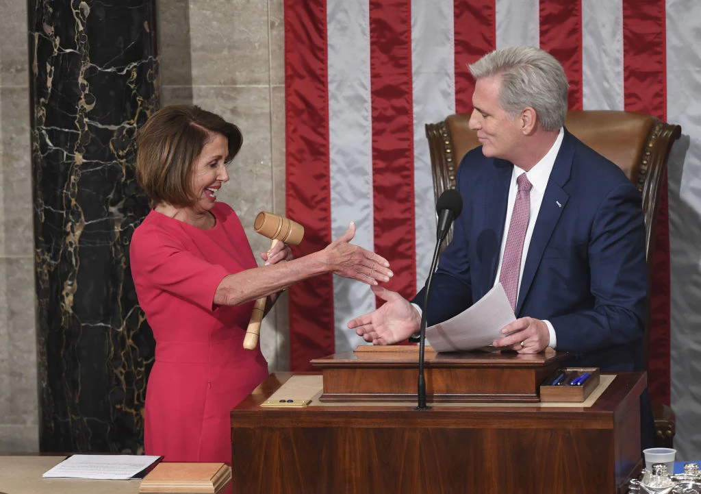 Incoming House Speaker Nancy Pelosi, D-CA, and Rep. Kevin McCarthy Minority Leader shake hands during the opening session of the 116th Congress at the US Capitol in Washington, DC, January 3, 2019. - Veteran Democratic lawmaker Nancy Pelosi was elected speaker of the House Thursday for the second time in her political career, a striking comeback for the only woman ever to hold the post.