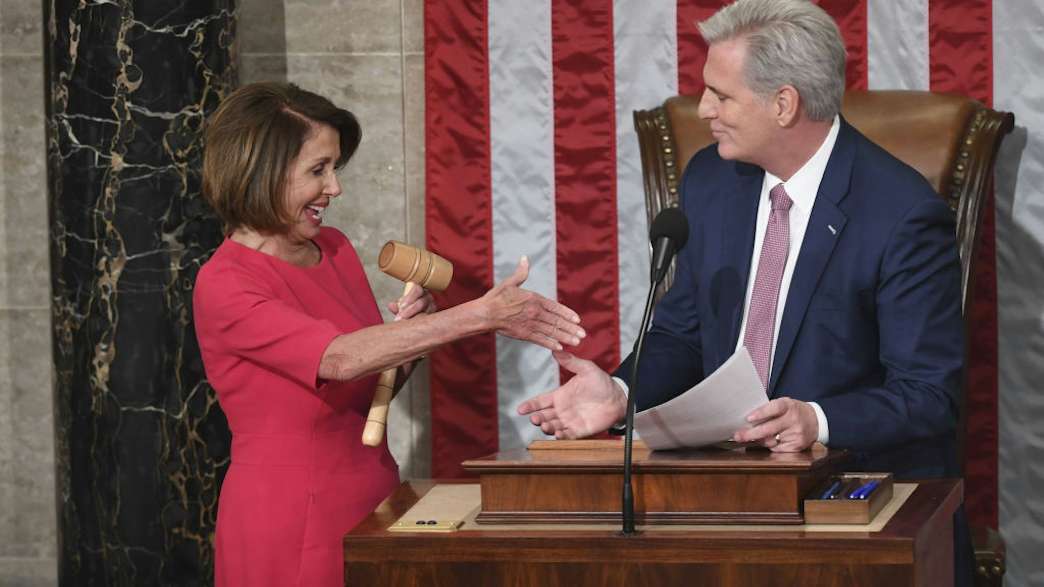 Incoming House Speaker Nancy Pelosi, D-CA, and Rep. Kevin McCarthy Minority Leader shake hands during the opening session of the 116th Congress at the US Capitol in Washington, DC, January 3, 2019. - Veteran Democratic lawmaker Nancy Pelosi was elected speaker of the House Thursday for the second time in her political career, a striking comeback for the only woman ever to hold the post.