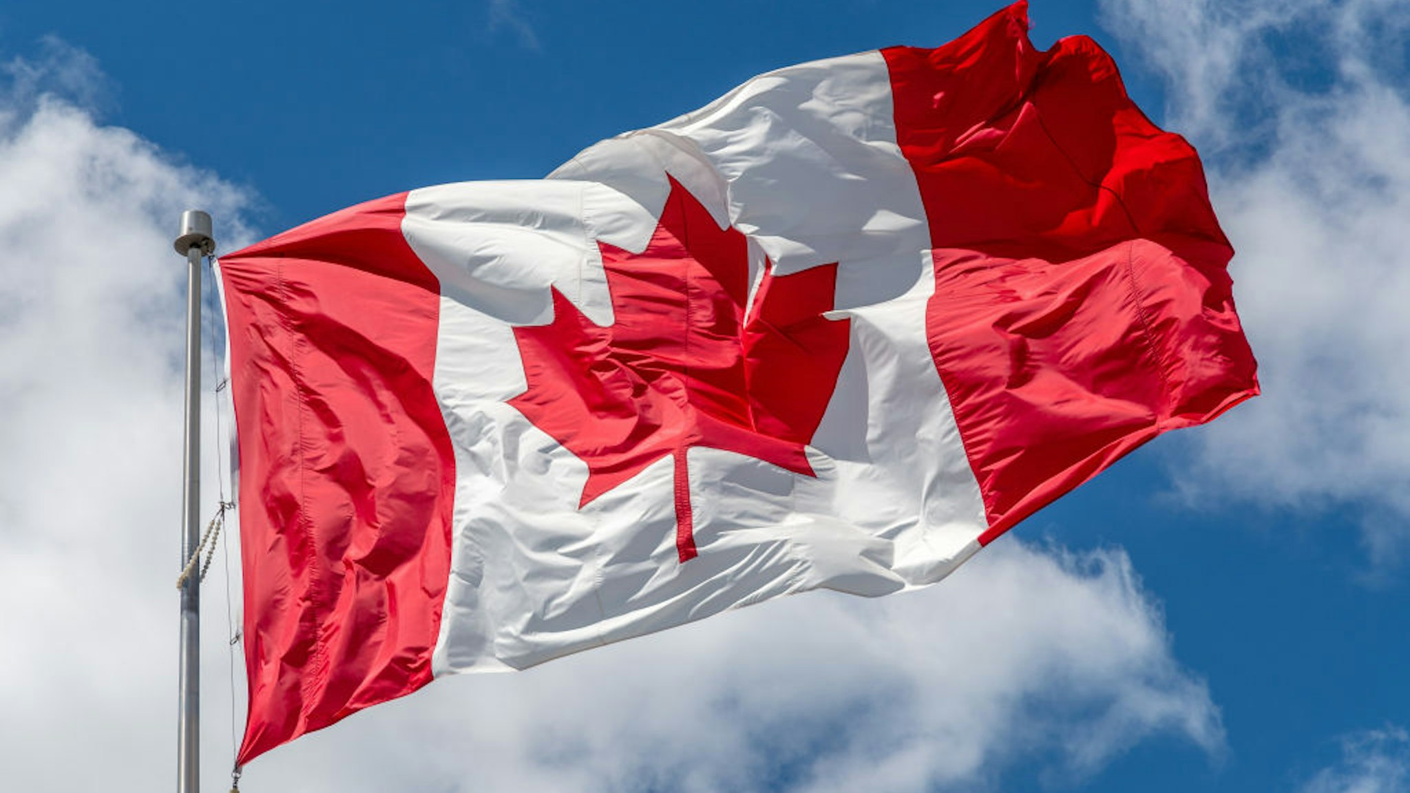 TORONTO, ONTARIO, CANADA - 2020/06/12: Canadian National flag waving on a clear sunny day. (Photo by Roberto Machado Noa/LightRocket via Getty Images)