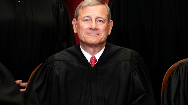 WASHINGTON, DC - APRIL 23: Chief Justice John Roberts sits during a group photo of the Justices at the Supreme Court in Washington, DC on April 23, 2021. (Photo by Erin Schaff-Pool/Getty Images)