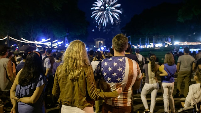 Spectators watch the annual Independence Day fireworks display outside the Philadelphia Museum of Art in Philadelphia on July 4, 2021. (Photo by Ed JONES / AFP) (Photo by ED JONES/AFP via Getty Images)