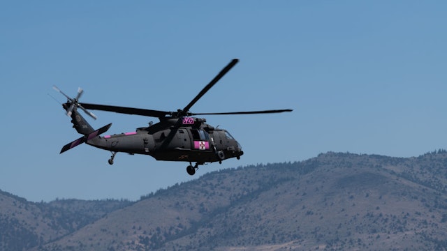 LAKEVIEW, OR - JULY 22: Members of the U.S. National Guard fly a helicopter to view the Bootleg Fire on July 22, 2021 in Lakeview, Oregon. The Bootleg Fire, which started on July 6th near Beatty, Oregon, has burned over 399,000 acres and is currently 38 percent contained. (Photo by Mathieu Lewis-Rolland/Getty Images)