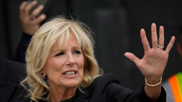 U.S. first lady Jill Biden waves as she departs after speaking while a FedEx cargo plane delivered baby formula at Dulles International Airport on May 25, 2022 in Dulles, Virginia.