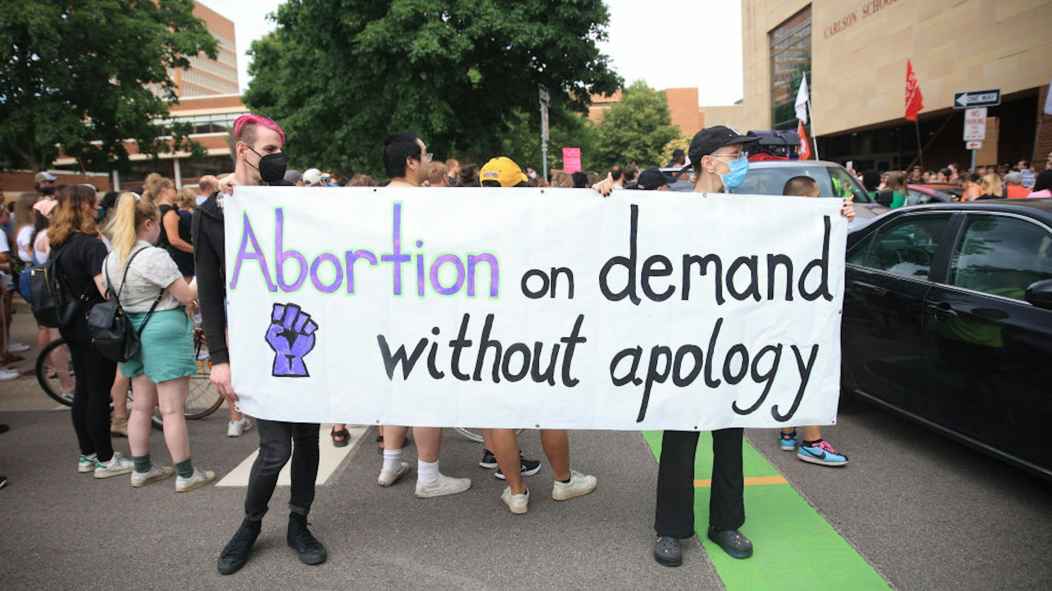 MINNEAPOLIS, UNITED STATES - JUNE 24: Abortion rights demonstrators gather near the Hubert H. Humphrey School of Public Affairs at the University of Minnesota in Minneapolis, Minnesota, United States on June 24, 2022. The U.S. Supreme Court on Friday overturned the landmark Roe v. Wade case, ending the constitutional protections for abortions that were in place for nearly 50 years. While some statesâ laws will and have changed to outlaw abortions, abortion remains legal in Minnesota. (Photo by Nikolas Liepins/Anadolu Agency via Getty Images)