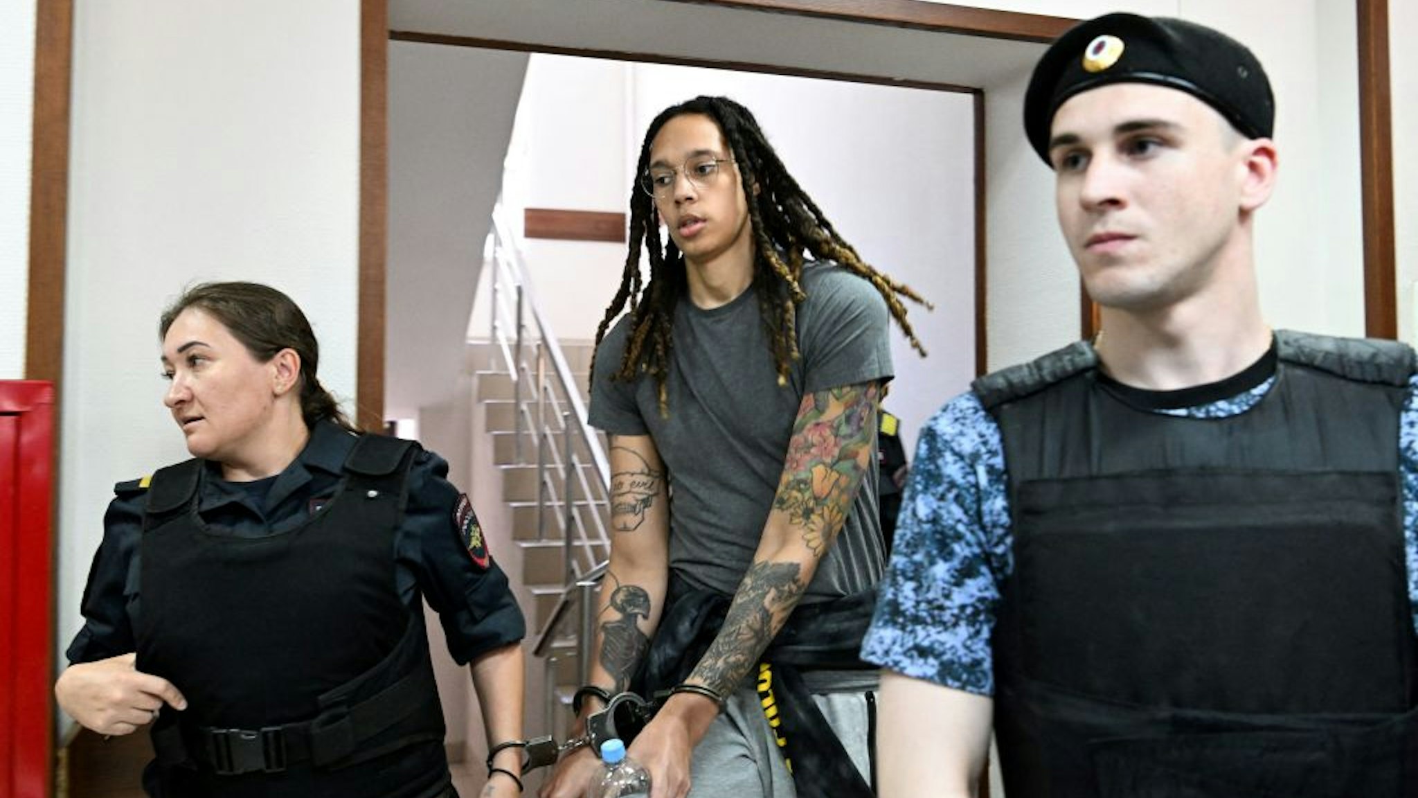 TOPSHOT - US WNBA basketball superstar Brittney Griner arrives to a hearing at the Khimki Court, outside Moscow on June 27, 2022. - Griner, a two-time Olympic gold medallist and WNBA champion, was detained at Moscow airport in February on charges of carrying in her luggage vape cartridges with cannabis oil, which could carry a 10-year prison sentence. (Photo by Kirill KUDRYAVTSEV / AFP) (Photo by KIRILL KUDRYAVTSEV/AFP via Getty Images)