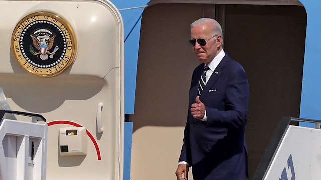 US President Joe Biden gives a thumbs up before boarding Air Force One to depart Israel's Ben Gurion Airport on July 15, 2022. - Biden is travelling to Saudi Arabia after two-day visit to Israel.