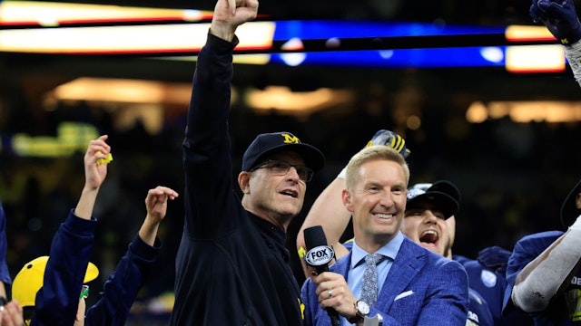 Head coach Jim Harbaugh of the Michigan Wolverines talks to the fans after winning the Big Ten Football Championship against the Iowa Hawkeyes at Lucas Oil Stadium on December 04, 2021 in Indianapolis, Indiana.