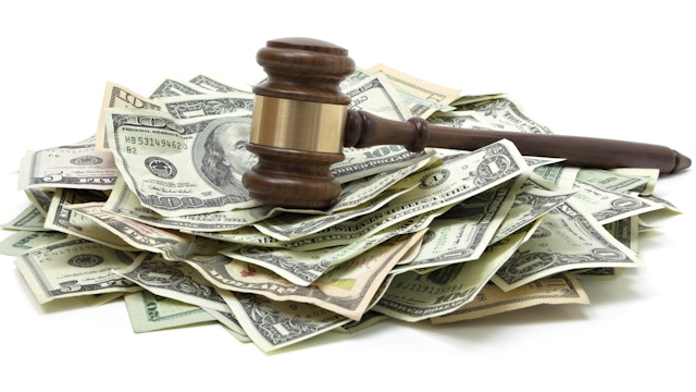Gavel and pile of money