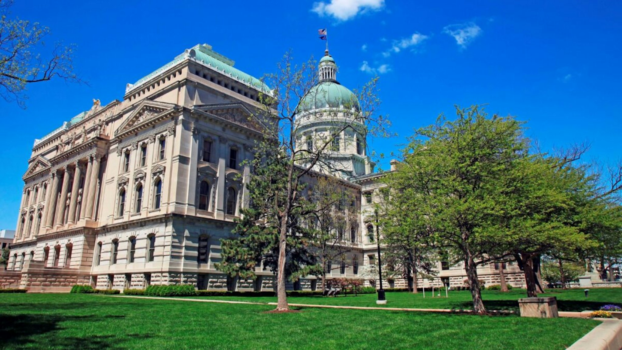 State capitol building in downtown Indianapolis Indiana on a sunny spring morning, Indianapolis is the capital city of Indiana and is located in the center of the state with the capitol building located downtown.