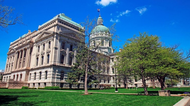 State capitol building in downtown Indianapolis Indiana on a sunny spring morning, Indianapolis is the capital city of Indiana and is located in the center of the state with the capitol building located downtown.