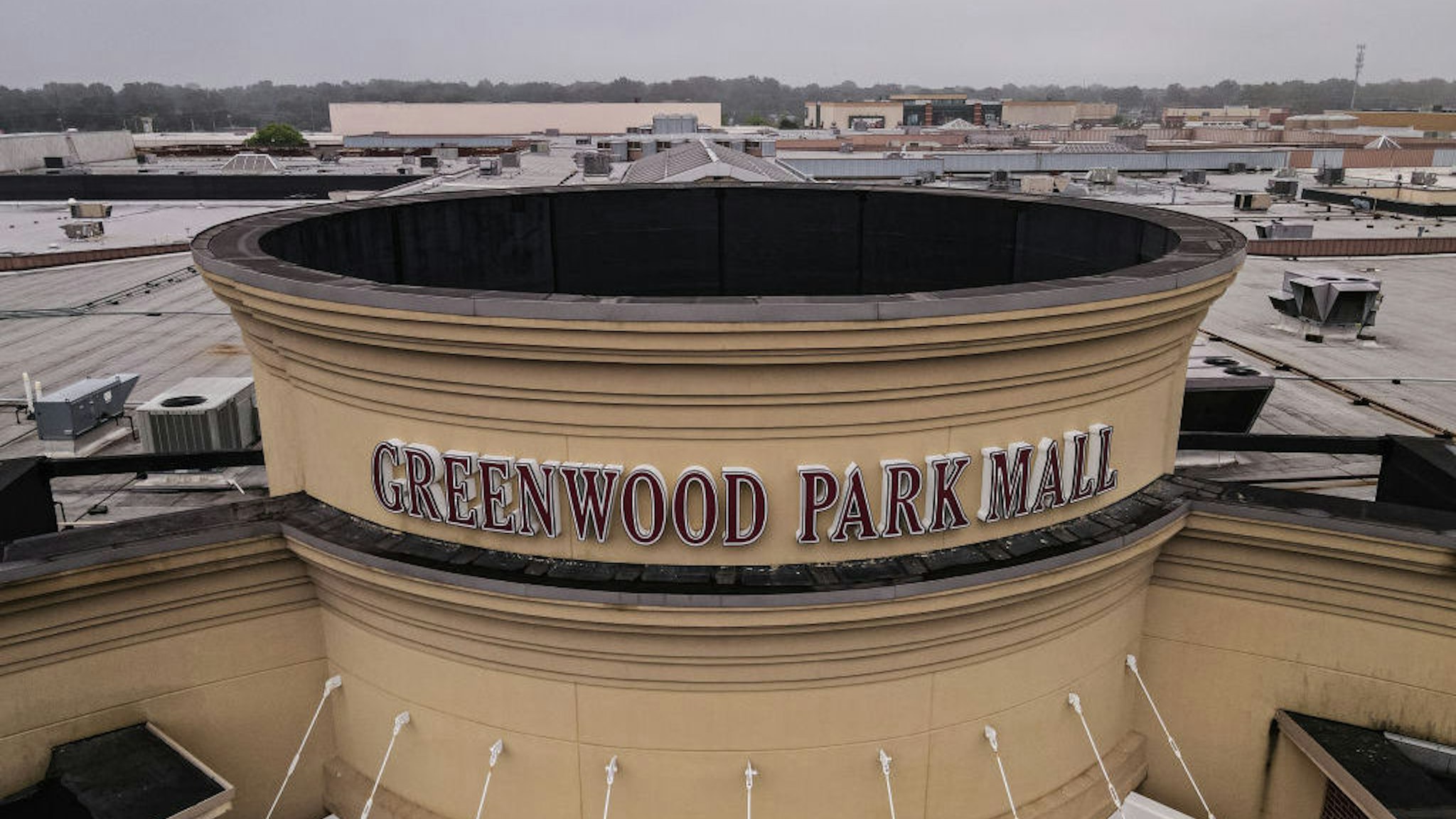 GREENWOOD, IN - JULY 18: In this aerial view, the main entrance of Greenwood Park Mall is seen on July 18, 2022 in Greenwood, Indiana. A gunman reportedly opened fire within the mall food court on July 17, killing three and injuring two before being killed by an armed bystander. (Photo by Jon Cherry/Getty Images)