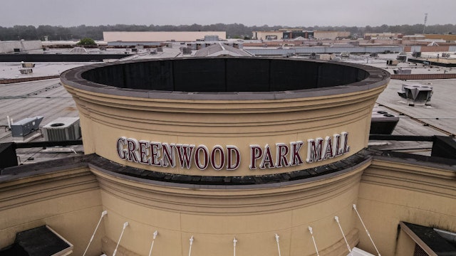 GREENWOOD, IN - JULY 18: In this aerial view, the main entrance of Greenwood Park Mall is seen on July 18, 2022 in Greenwood, Indiana. A gunman reportedly opened fire within the mall food court on July 17, killing three and injuring two before being killed by an armed bystander. (Photo by Jon Cherry/Getty Images)