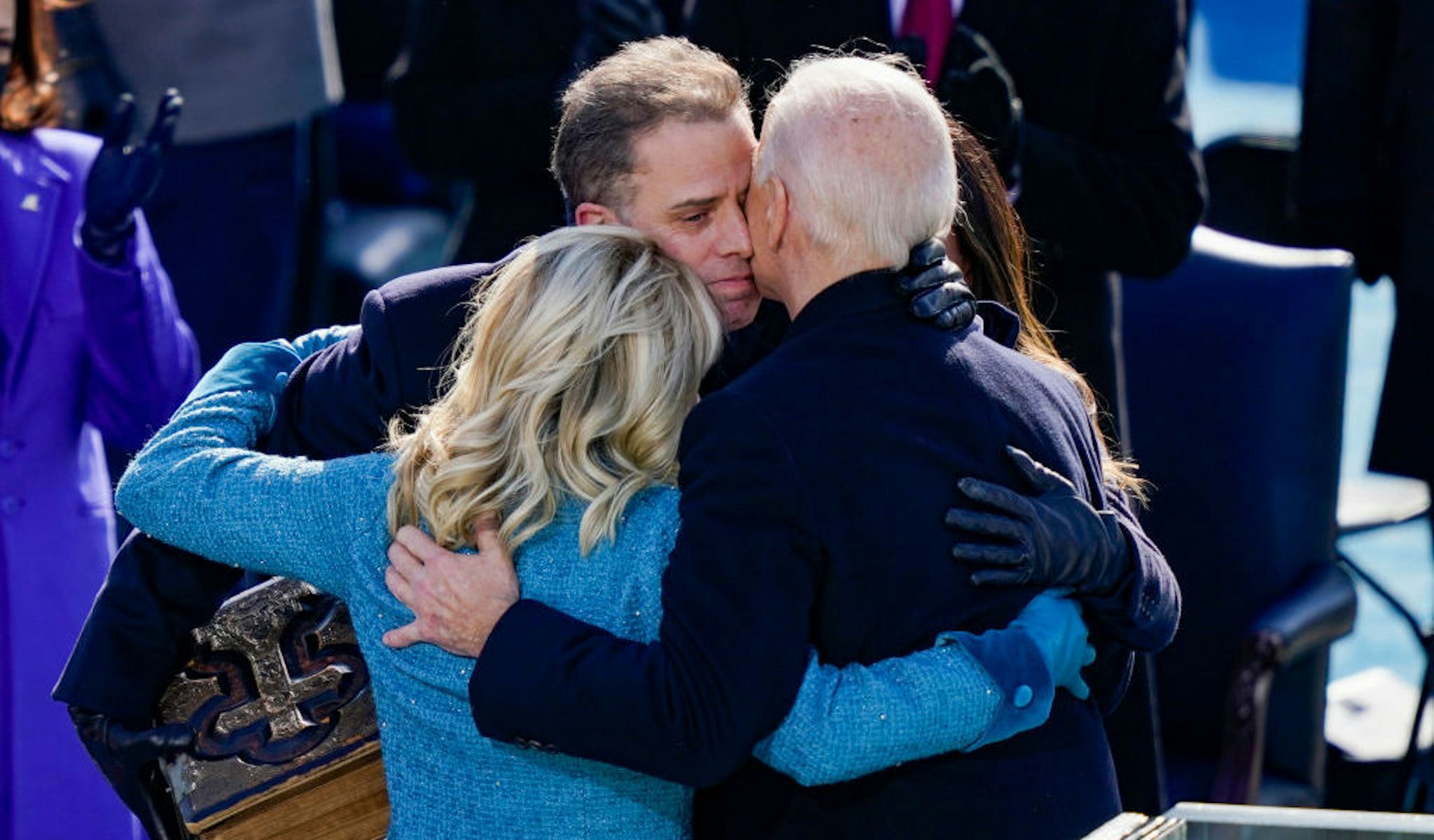WASHINGTON, DC - JANUARY 20: U.S. President Joe Biden embraces his family First Lady Dr. Jill Biden, son Hunter Biden and daughter Ashley after being sworn in during his inauguation on the West Front of the U.S. Capitol on January 20, 2021 in Washington, DC. During today's inauguration ceremony Joe Biden becomes the 46th president of the United States. (Photo by Drew Angerer/Getty Images)