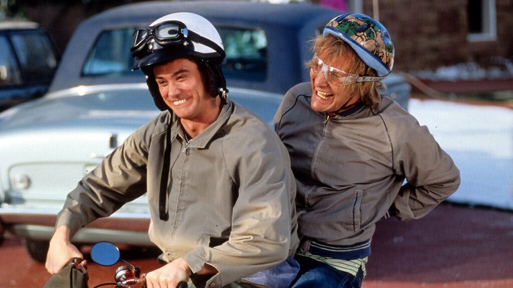Jim Carrey and Jeff Daniels riding bike in a scene from the film 'Dumb & Dumber', 1994.