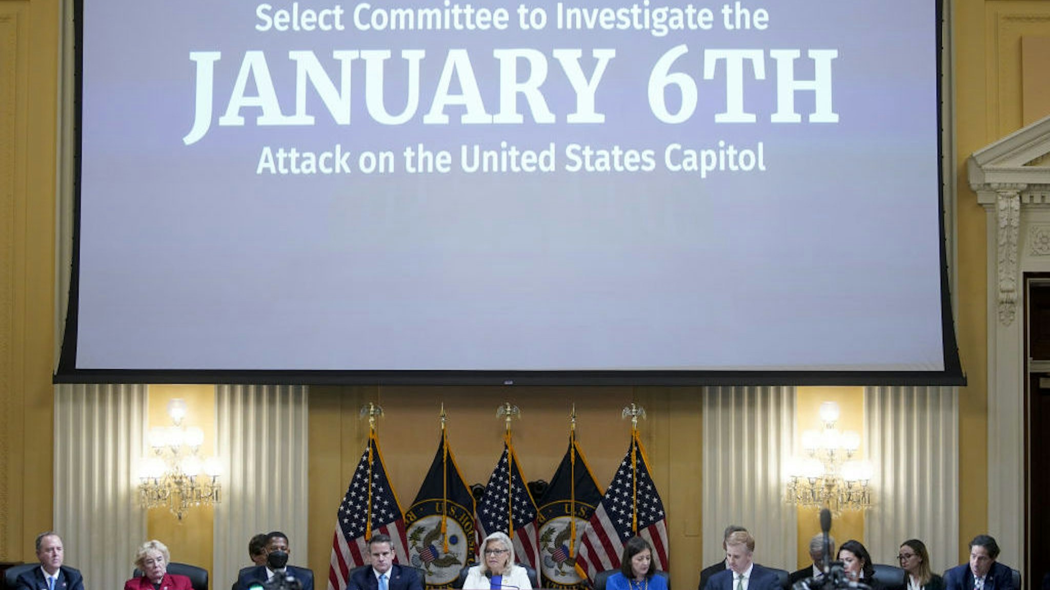 Representative Liz Cheney, a Republican from Wyoming, bottom center, speaks during a hearing of the Select Committee to Investigate the January 6th Attack on the US Capitol in Washington, D.C., US, on Thursday, July 21, 2022. Former President Donald Trump's 187 minutes of inaction as an armed mob attacked the US Capitol will be the focus of the second prime-time hearing by the House committee investigating the Jan. 6, 2021 insurrection. Photographer: Al Drago/Bloomberg
