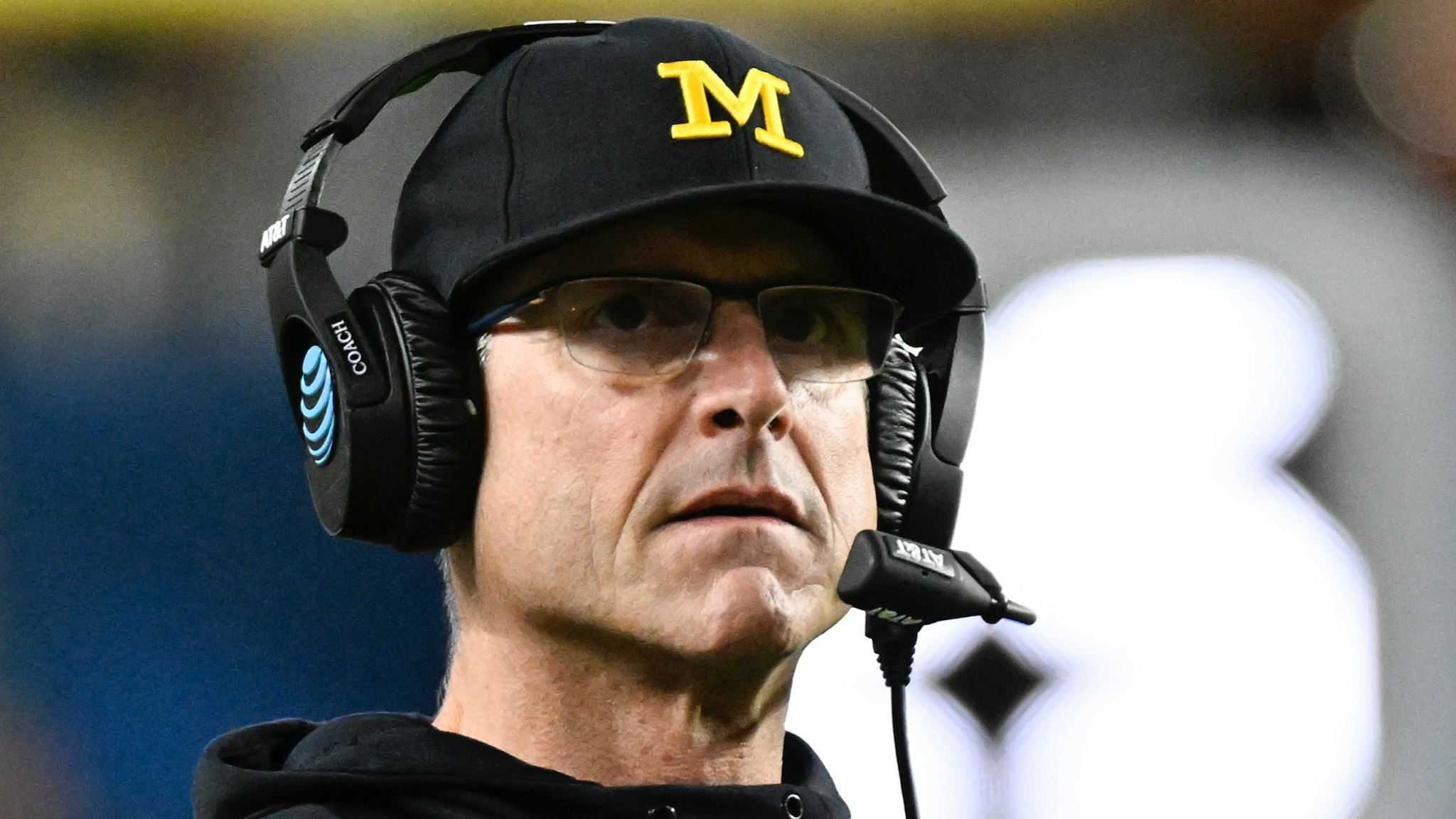 Michigan Wolverines head coach Jim Harbaugh watches from the sidelines during the College Football Playoff Semifinal game between the Georgia Bulldogs and the Michigan Wolverines at the Capital One Orange Bowl on December 31, 2021 at the Hard Rock Stadium in Miami Gardens, FL.