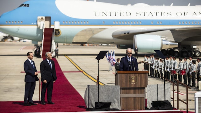 U.S. President Joe Biden speaks during the welcome ceremony as Israeli Prime Minister Yair Lapid and Israeli President Isaac Herzog listen during Biden's visit to Israel on July 13, 2022 in Lod, Israel
