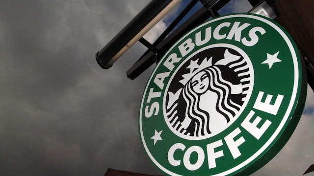 The Starbucks logo hangs outside one of the company's cafes in Northwich on 3 July, 2008 in Northwich, England.