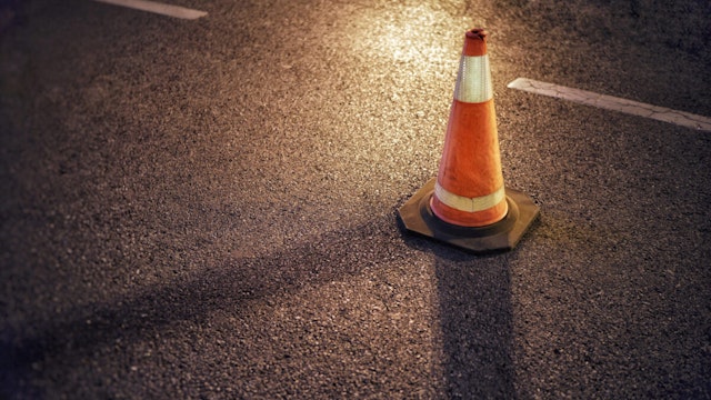 High Angle View Of Traffic Cone On Road At Night