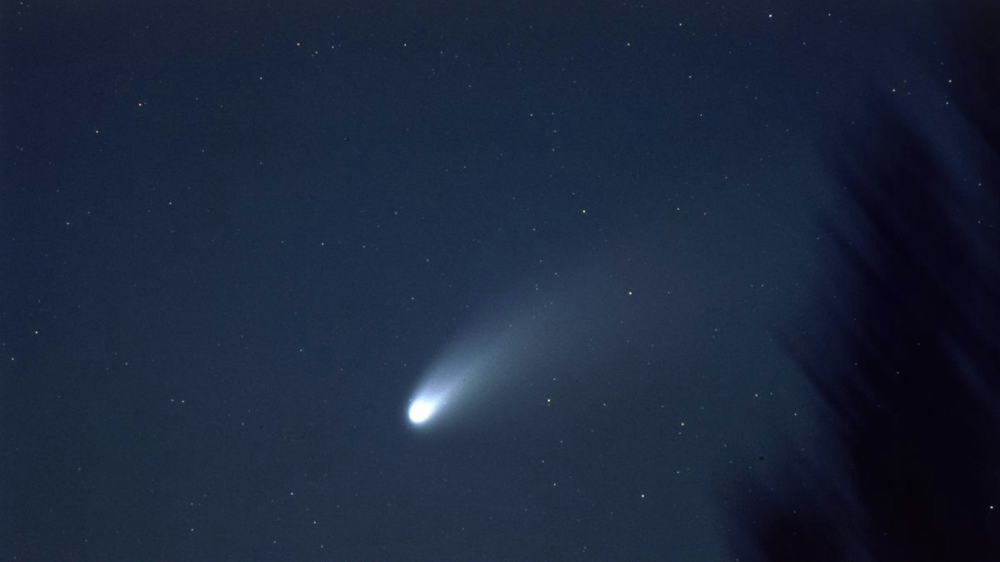 The Comet Hale-Bopp passes across the night sky, 1997.
