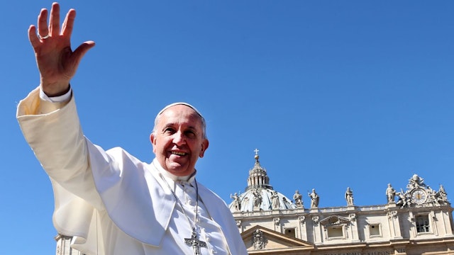 Pope Francis waves to the faithful as he leaves St. Peter's Square at the the end of Palm Sunday Mass on March 29, 2015 in Vatican City, Vatican