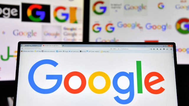 A picture taken on November 20, 2017 shows logos of US multinational technology company Google displayed on computers' screens.