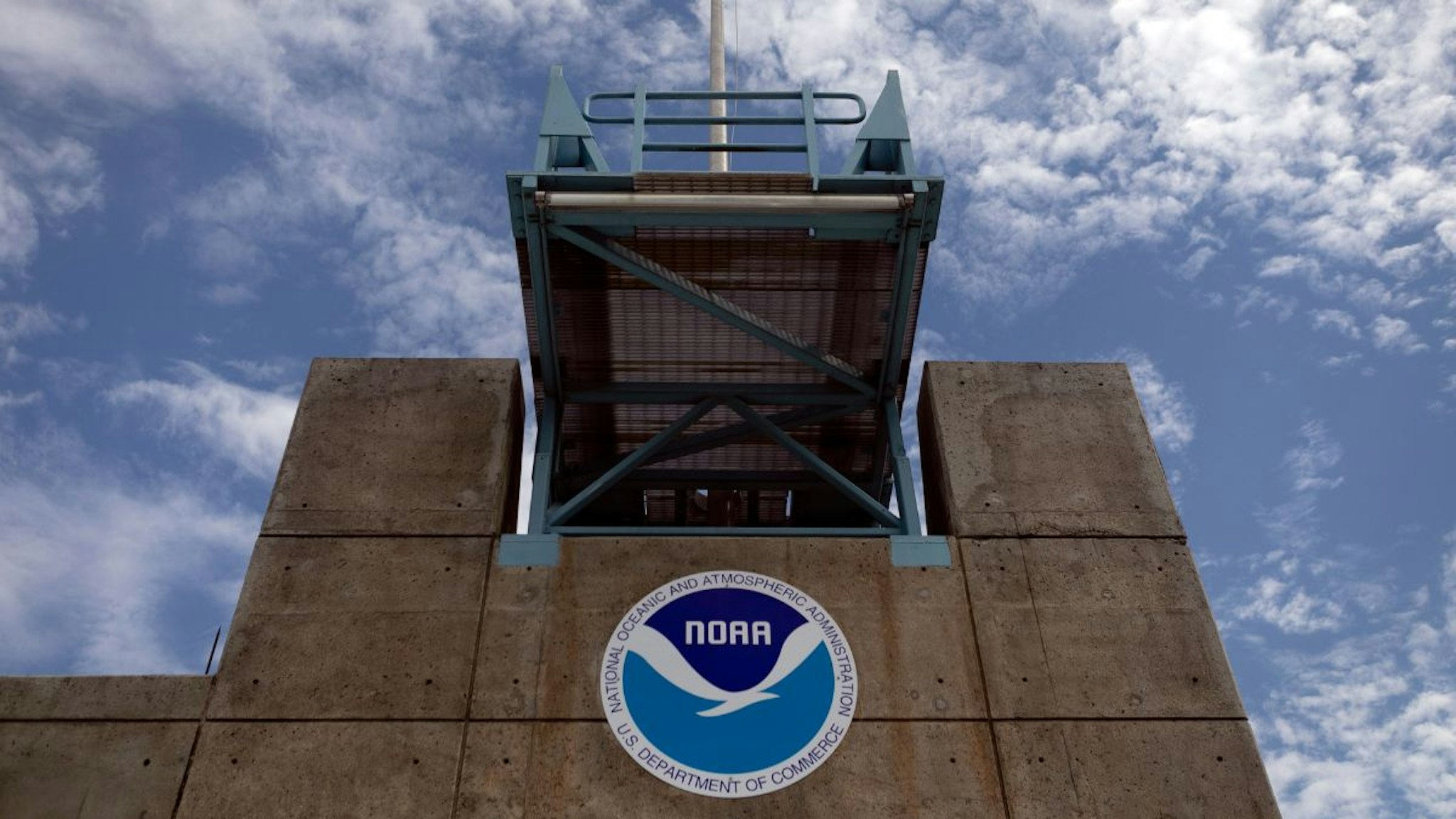 The logo of National Oceanic and Atmospheric Administration (NOAA) is seen at the Nation Hurricane Center on August 29, 2019 in Miami, Florida.