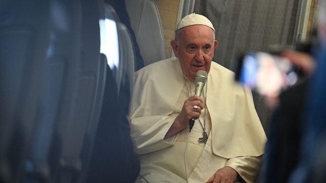 Pope Francis speaks to journalists on a plane on his way back from Canada.
