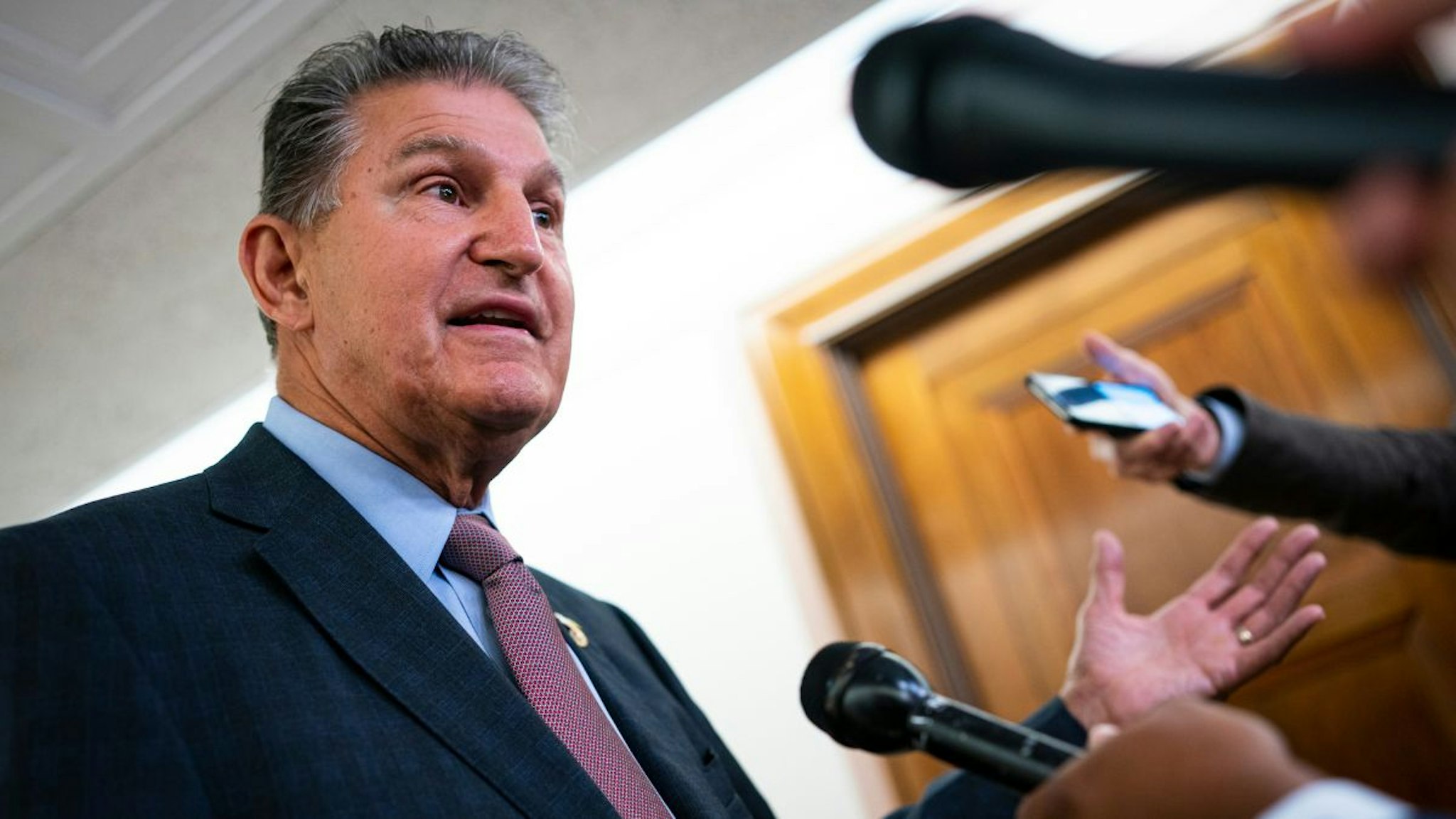 Senator Joe Manchin, a Democrat from West Virginia and chairman of the Senate Energy and Natural Resources Committee, speaks to members of the media prior to a hearing in Washington, D.C., US, on Tuesday, July 19, 2022.