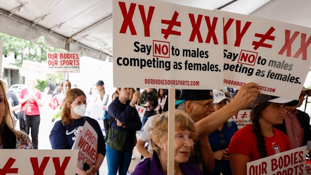 WASHINGTON, DC - JUNE 23: Demonstrators listen to the speaking program during an "Our Bodies, Our Sports" rally for the 50th anniversary of Title IX at Freedom Plaza on June 23, 2022 in Washington, DC.