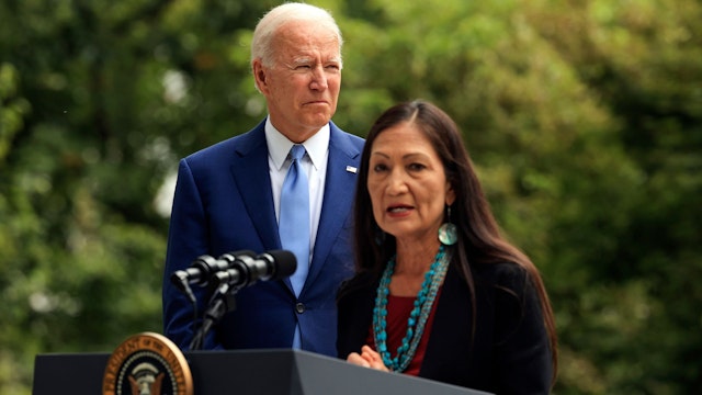 WASHINGTON, DC - OCTOBER 08: WASHINGTON, DC - OCTOBER 08: U.S. President Joe Biden listens as Secretary of the Interior Deb Haaland delivers remarks before Biden announced the expansion of areas of three national monuments at the White House on October 08, 2021 in Washington, DC.