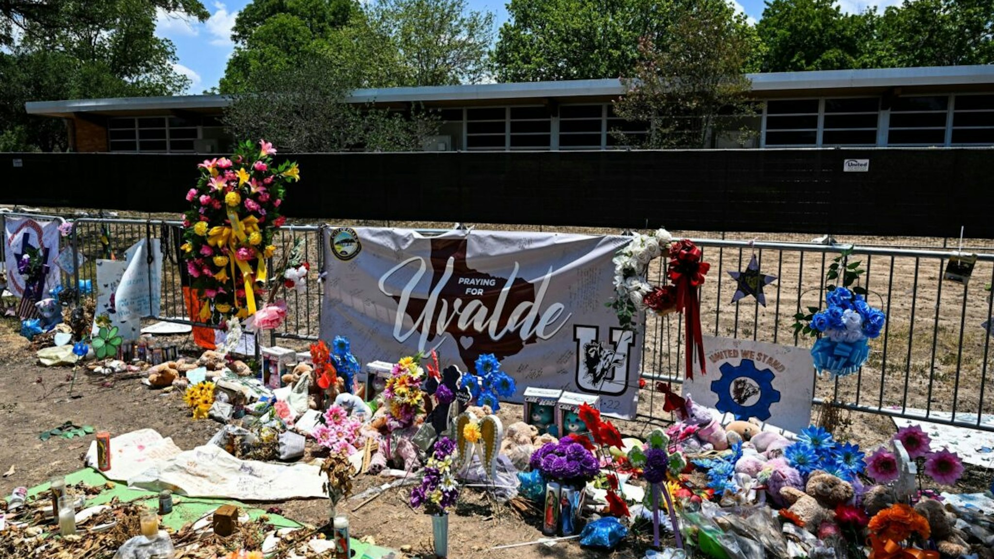 Mementos decorate a makeshift memorial to the victims of a shooting at Robb Elementary School in Uvalde, Texas, on June 30, 2022