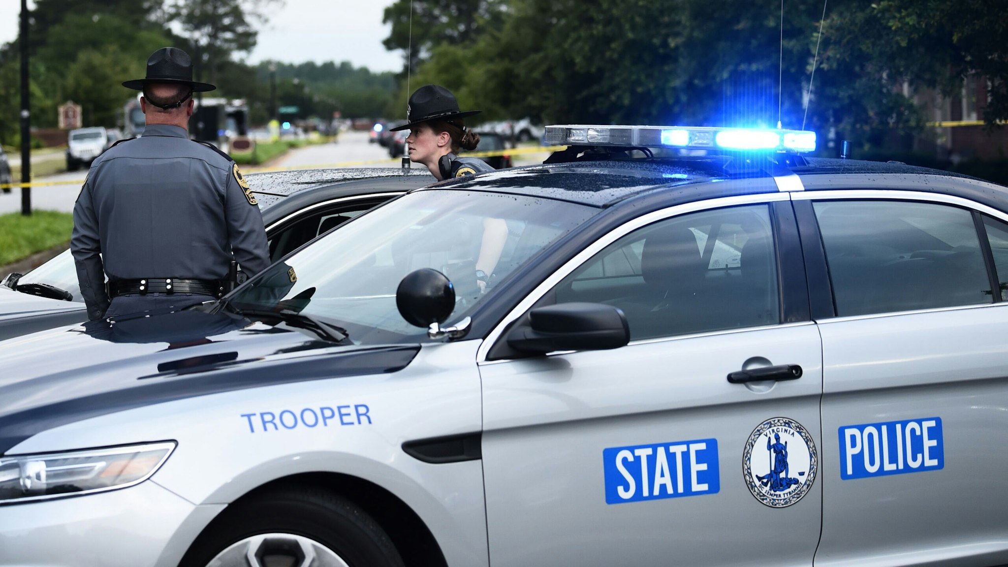 Virginia State Troopers guards a roadblock on June 1, 2019, at the scene of the mass shooting in the Virginia Beach Municipal center in Virginia, Beach, Virginia. - A municipal employee sprayed gunfire "indiscriminately" in the government building complex on May 31, 2019, police said, killing 12 people and wounding four in the latest mass shooting to rock the US.